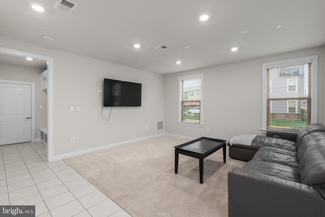 living area featuring baseboards, recessed lighting, and visible vents