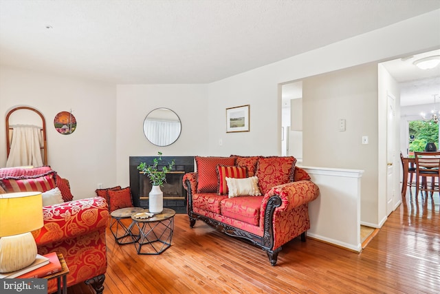 3203 Forest Run Dr, District Heights, MD 20747 - living area featuring a chandelier, wood-type flooring, and baseboards