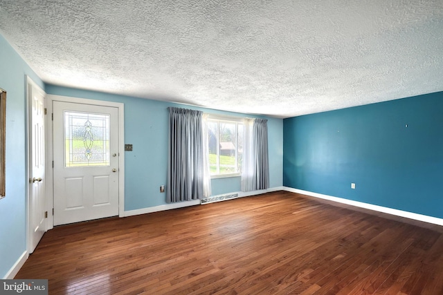 2042 Baltimore Pike, East Berlin, PA 17316 - foyer with a textured ceiling, baseboards, visible vents, and hardwood / wood-style floors