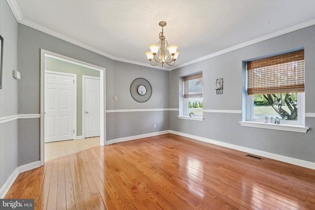 380 Bishop Hollow Rd, Newtown Square, PA 19073 - empty room featuring a chandelier, light wood-style floors, ornamental molding, and baseboards