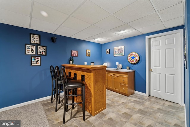 380 Bishop Hollow Rd, Newtown Square, PA 19073 - indoor dry bar featuring a drop ceiling and baseboards