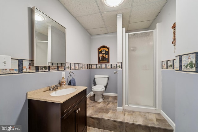 380 Bishop Hollow Rd, Newtown Square, PA 19073 - bathroom with a paneled ceiling, a shower stall, vanity, toilet, and baseboards