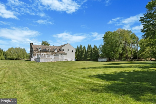 380 Bishop Hollow Rd, Newtown Square, PA 19073 - view of grassy yard with a storage unit and an outdoor structure