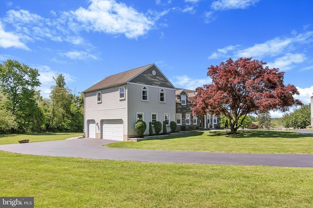 380 Bishop Hollow Rd, Newtown Square, PA 19073 - view of side of home featuring a garage, a yard, and asphalt driveway