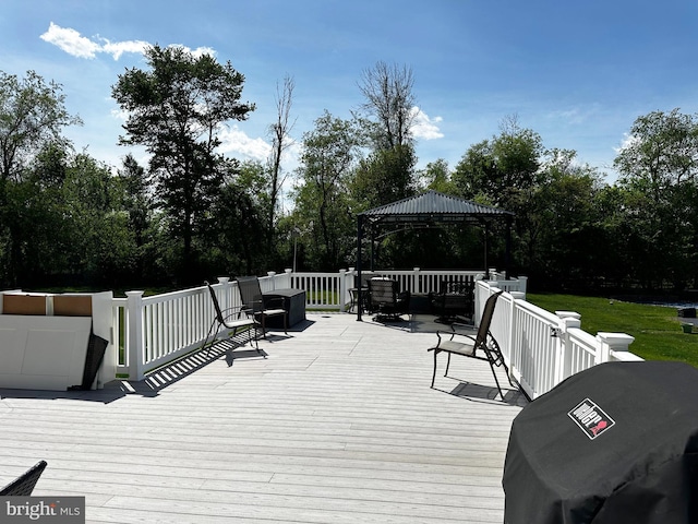 wooden deck with a gazebo