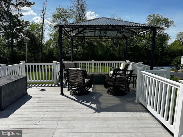 deck with a gazebo and an outdoor living space