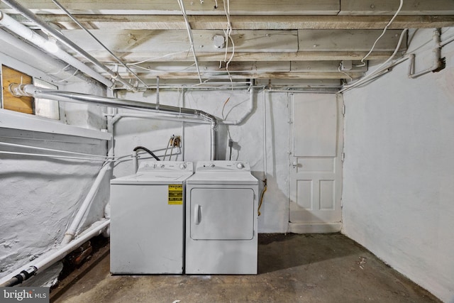 clothes washing area with laundry area and washing machine and clothes dryer