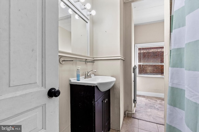 full bathroom featuring vanity and tile patterned flooring