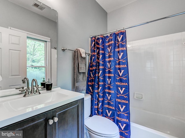 bathroom featuring toilet, vanity, and shower / bathtub combination with curtain