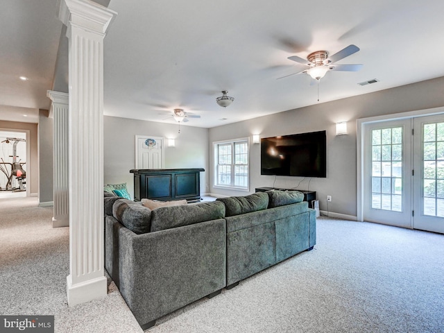living area with a ceiling fan, decorative columns, carpet, baseboards, and recessed lighting