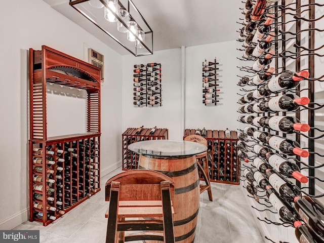 wine area with tile patterned floors and baseboards