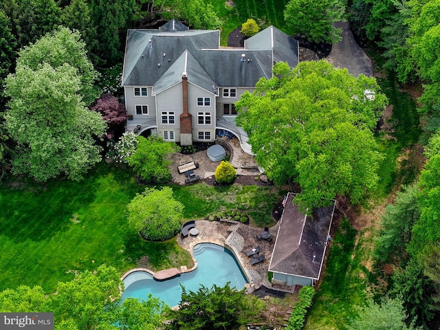view of subject property with a pool area