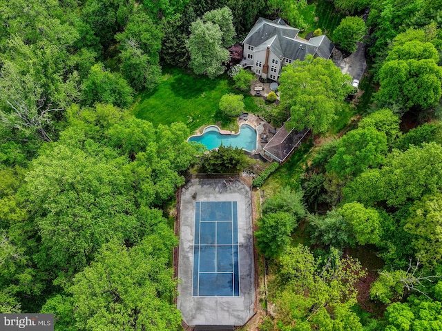 view of subject property with a pool area