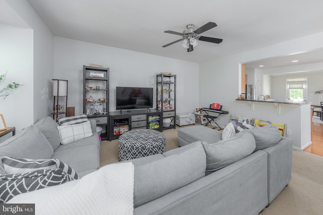 living area with recessed lighting, ceiling fan, and carpet