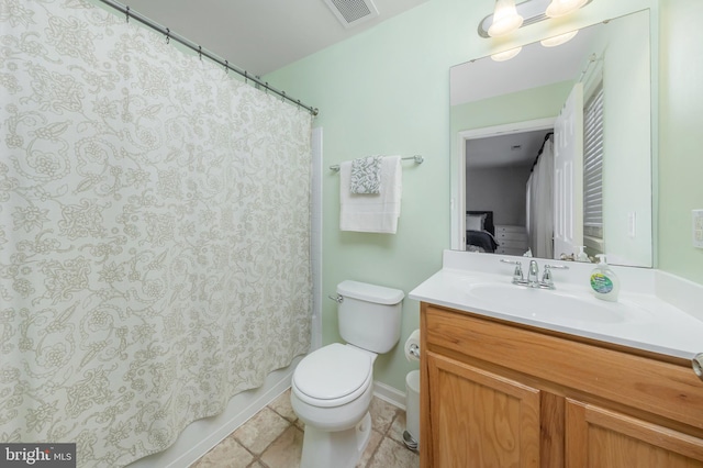 bathroom with visible vents, vanity, toilet, baseboards, and tile patterned floors