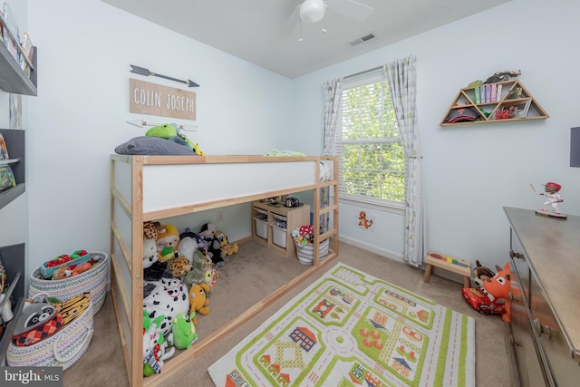 bedroom with baseboards, ceiling fan, carpet flooring, and visible vents
