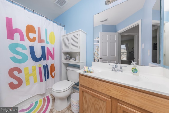 bathroom featuring visible vents, a shower with curtain, toilet, and vanity