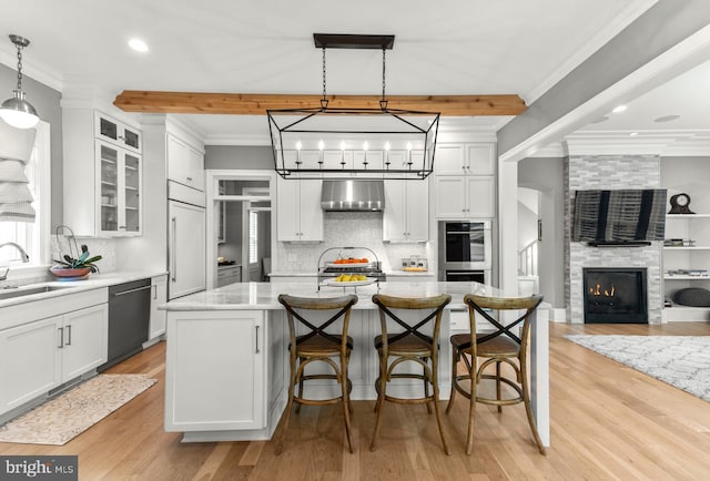 4416 Stanford St, Chevy Chase, MD 20815 - kitchen featuring a sink, dishwasher, backsplash, white cabinetry, and under cabinet range hood