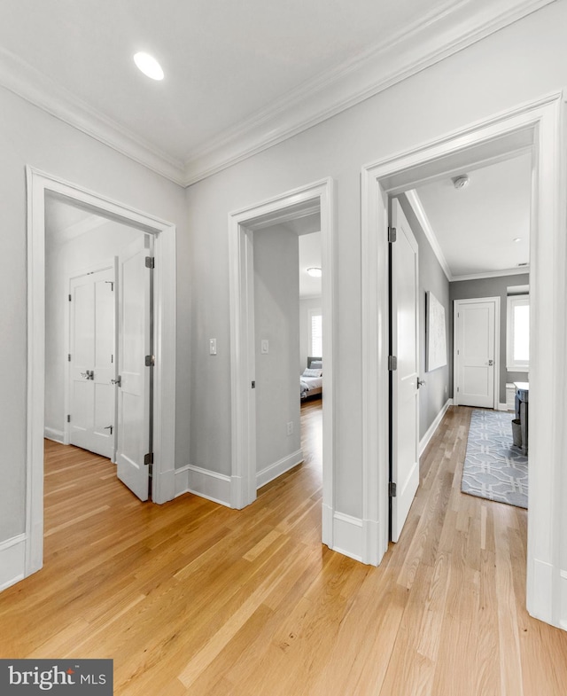 4416 Stanford St, Chevy Chase, MD 20815 - corridor with crown molding, baseboards, and light wood-style floors