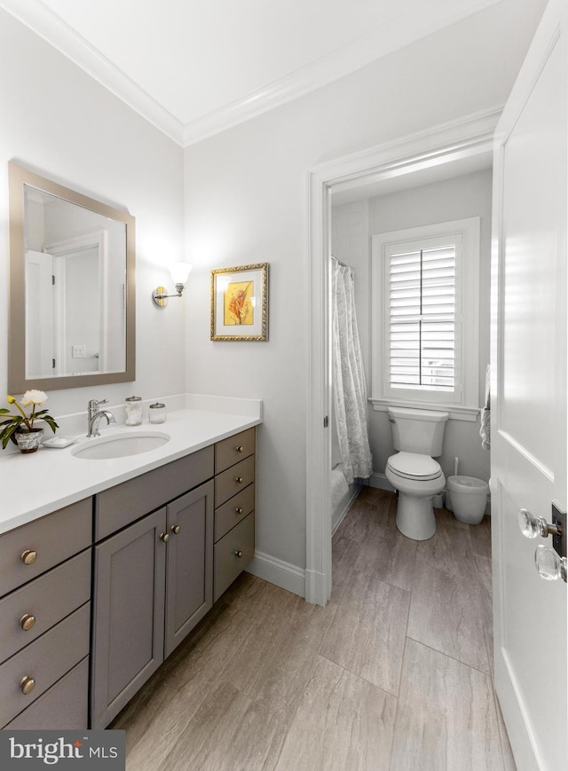 4416 Stanford St, Chevy Chase, MD 20815 - bathroom with crown molding, vanity, curtained shower, wood finished floors, and toilet