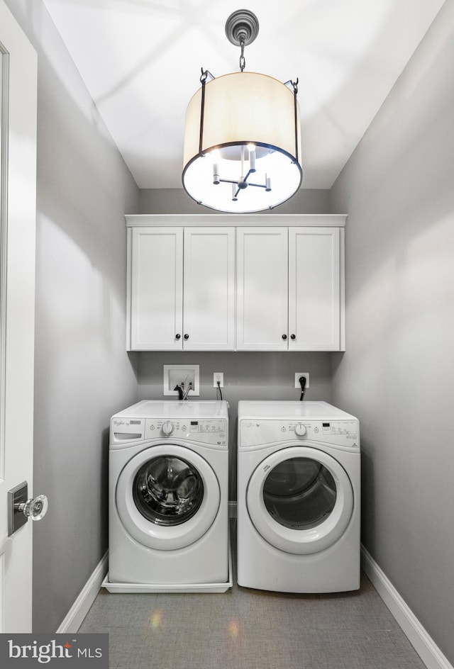 4416 Stanford St, Chevy Chase, MD 20815 - laundry room featuring baseboards, cabinet space, and washer and clothes dryer