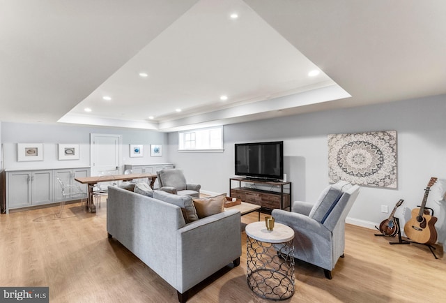 4416 Stanford St, Chevy Chase, MD 20815 - living area with baseboards, recessed lighting, a tray ceiling, and light wood-style flooring