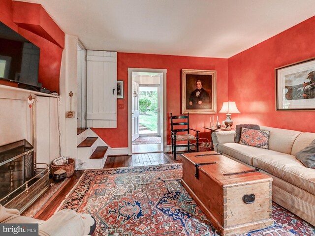 living area featuring wood finished floors and baseboards
