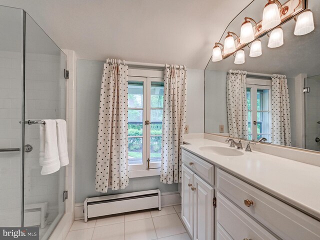 full bath featuring baseboard heating, tile patterned floors, a stall shower, and vanity