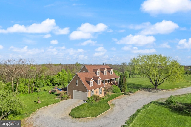 bird's eye view featuring a wooded view
