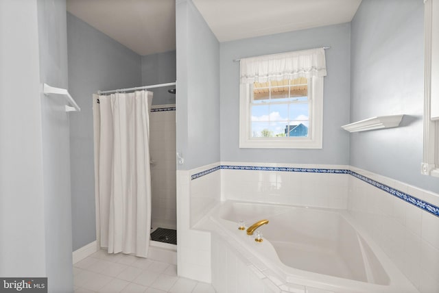 bathroom with tile patterned floors, a shower stall, and a bath