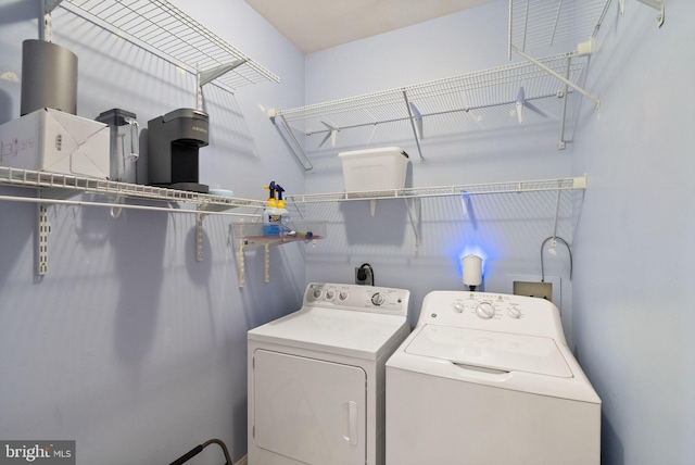 washroom featuring laundry area and independent washer and dryer