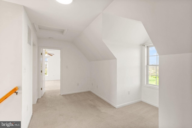 bonus room featuring visible vents, lofted ceiling, baseboards, attic access, and carpet