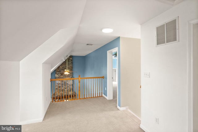 interior space with baseboards, visible vents, and carpet