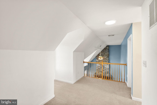 bonus room featuring ceiling fan, carpet, baseboards, lofted ceiling, and visible vents