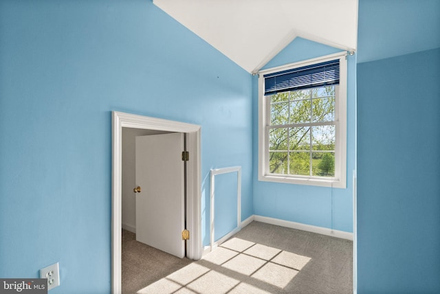 bonus room featuring baseboards, carpet flooring, and vaulted ceiling