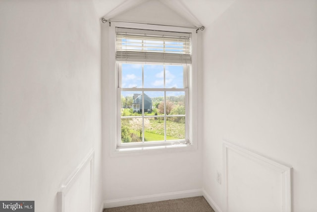 room details featuring baseboards and carpet flooring