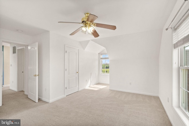 unfurnished bedroom with carpet floors, a ceiling fan, baseboards, and visible vents
