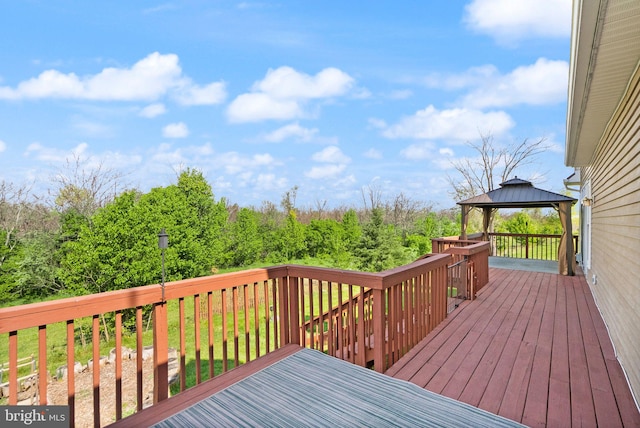 wooden deck featuring a gazebo