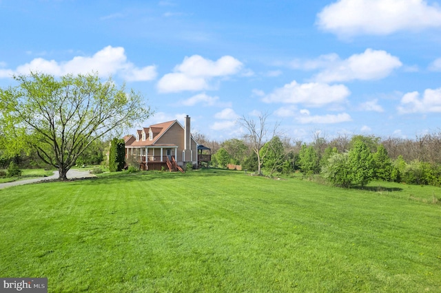 view of yard with a deck