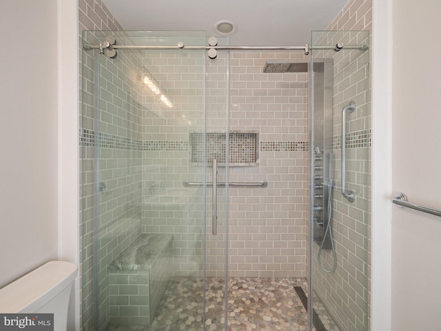 bathroom featuring a stall shower