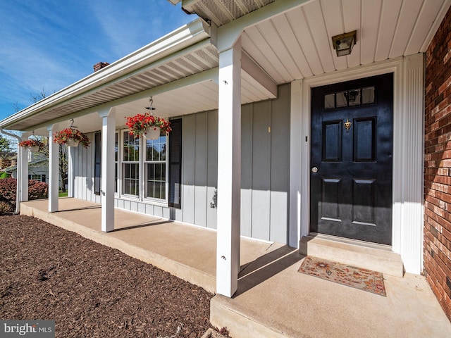 entrance to property featuring a porch