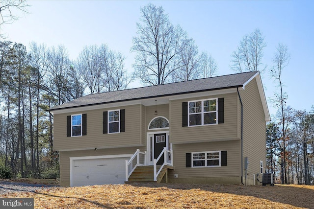 raised ranch with central AC and a garage