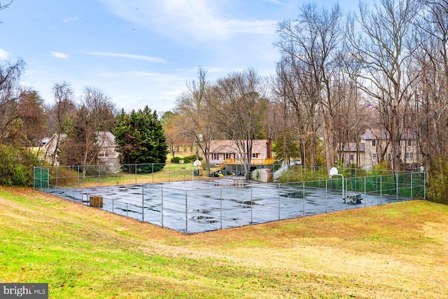 view of pool featuring a lawn and fence