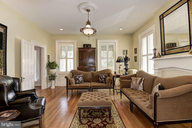 living room with recessed lighting and hardwood / wood-style floors