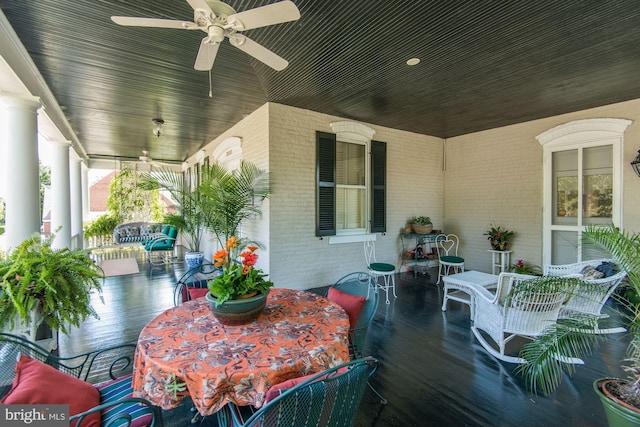 exterior space with covered porch, ceiling fan, and outdoor dining space