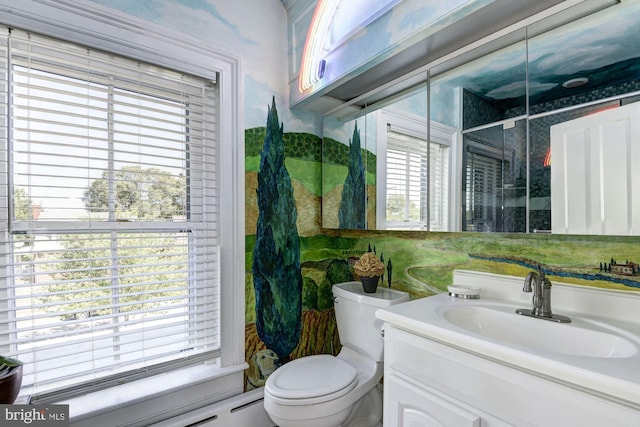 bathroom featuring an enclosed shower, toilet, and vanity