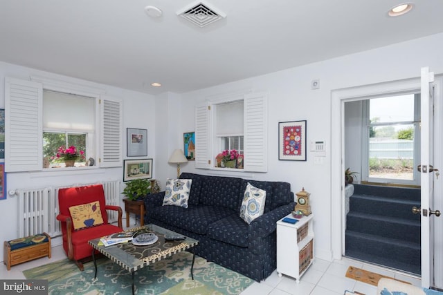 tiled living area featuring recessed lighting and visible vents