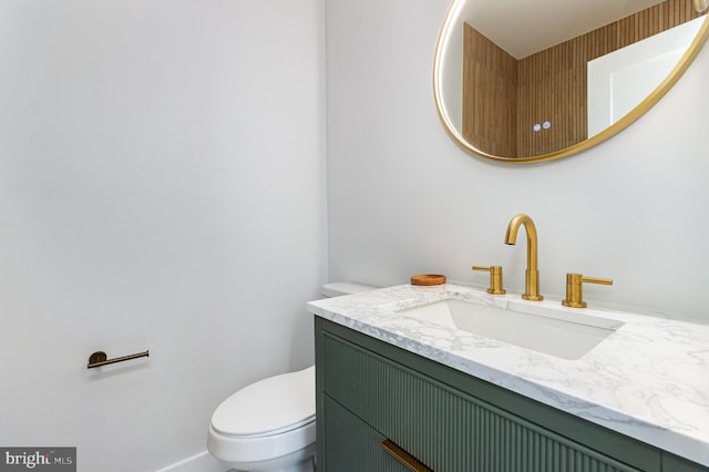 407 16th St SE, Washington, DC 20003 - bathroom featuring vanity, toilet, and baseboards