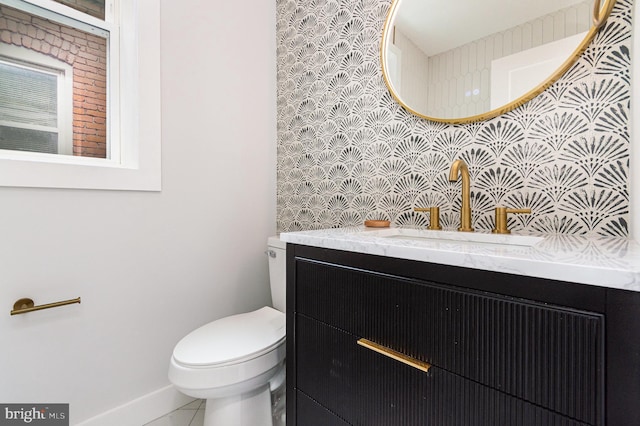 407 16th St SE, Washington, DC 20003 - half bathroom featuring toilet, vanity, tile patterned flooring, and baseboards