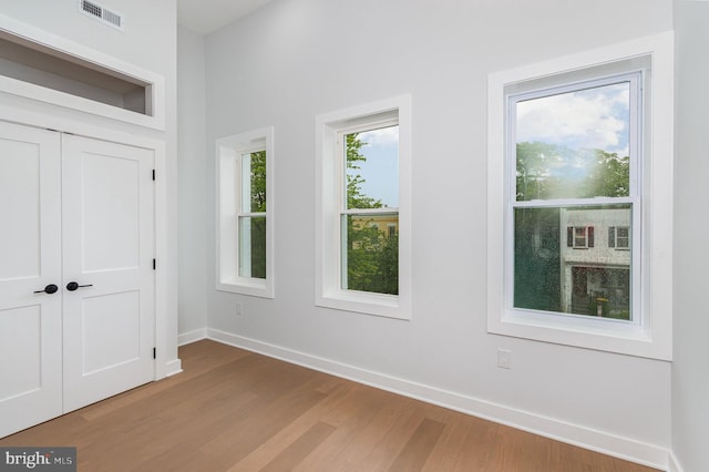 407 16th St SE, Washington, DC 20003 - unfurnished bedroom with wood finished floors, baseboards, and a closet